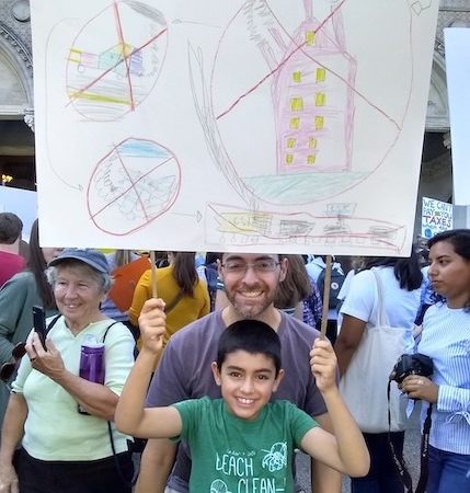 The author and his son at the Global Climate Strike in Hartford, Connecticut